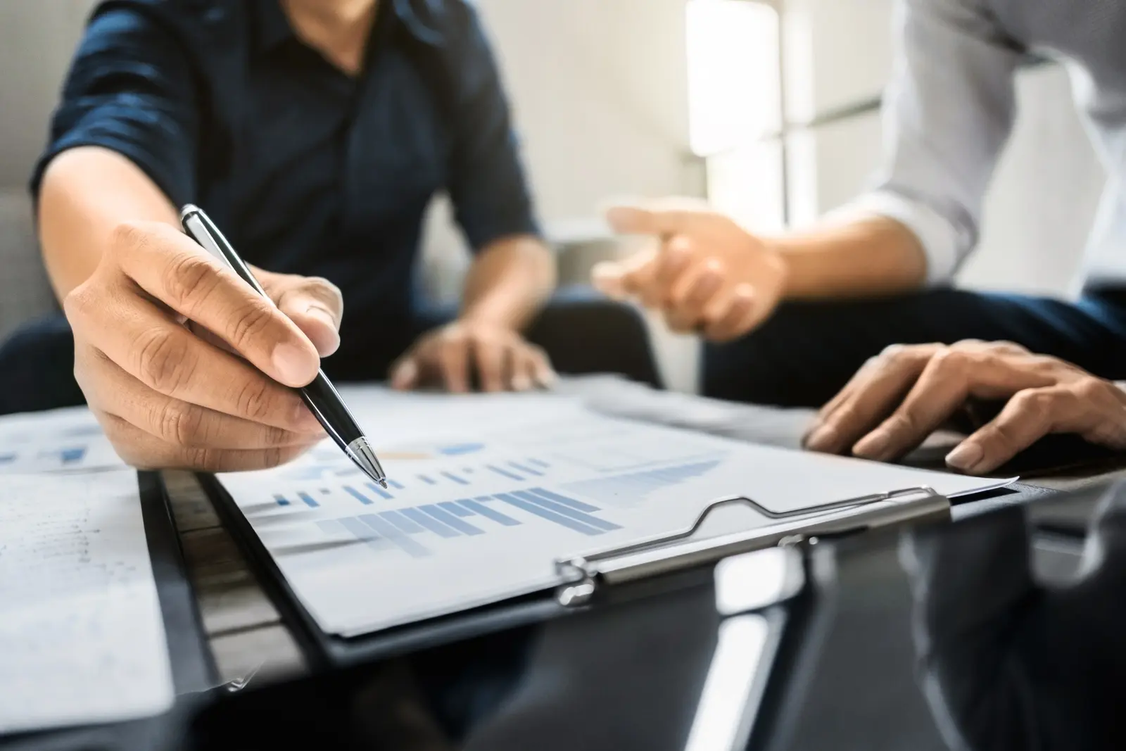 Business executives analyzing on valuation